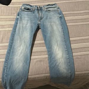 lightly worn blue slim jeans